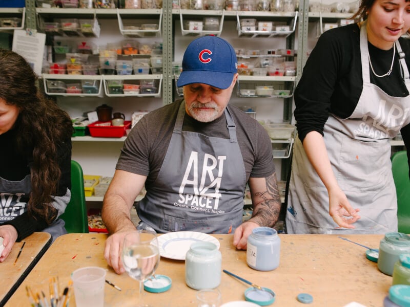 People painting ceramics in London